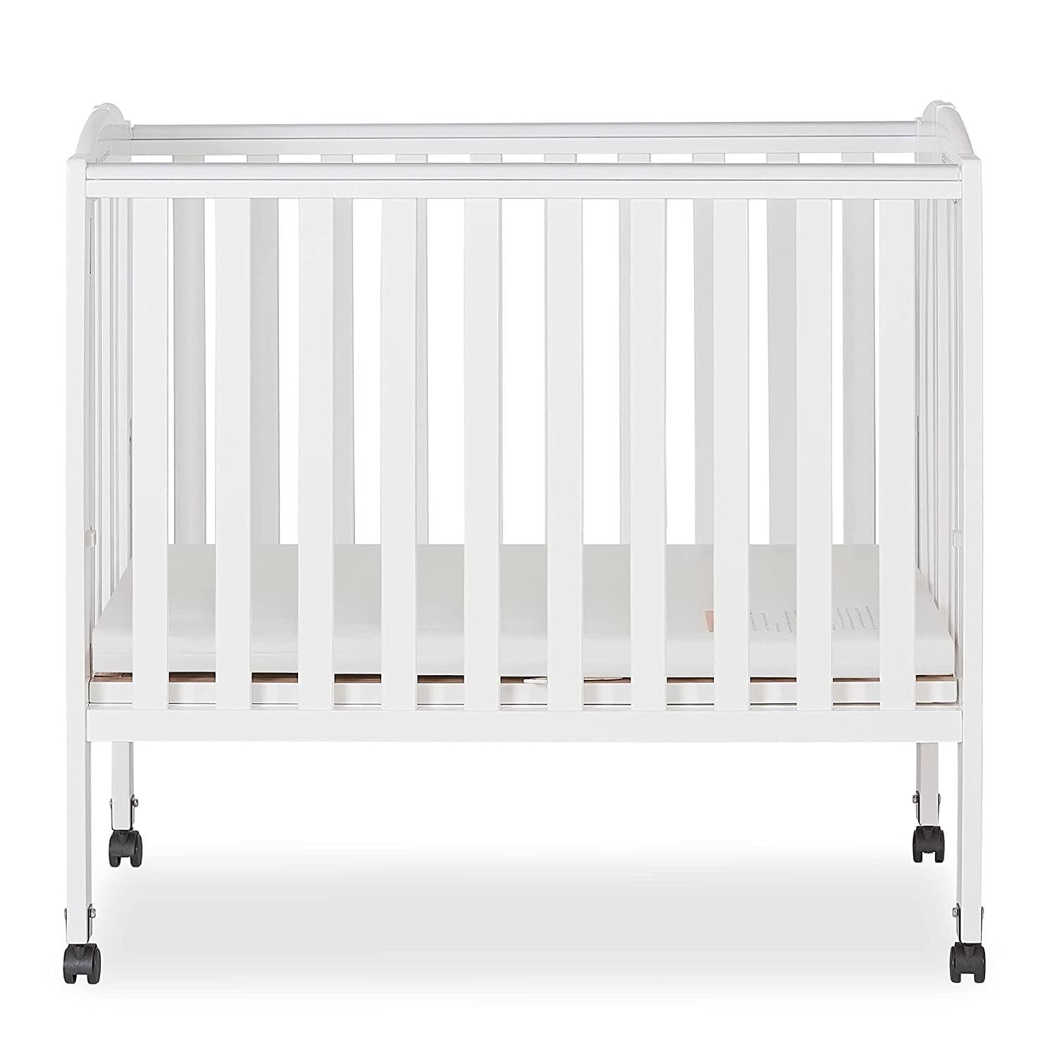 Dream on Me 2 - in - 1 Folding Portable Mini Crib in White. Mattress Pad Included. Easy to Fold and Store Baby Crib. Two Adjustable Mattress Height Positions Convertible Crib
