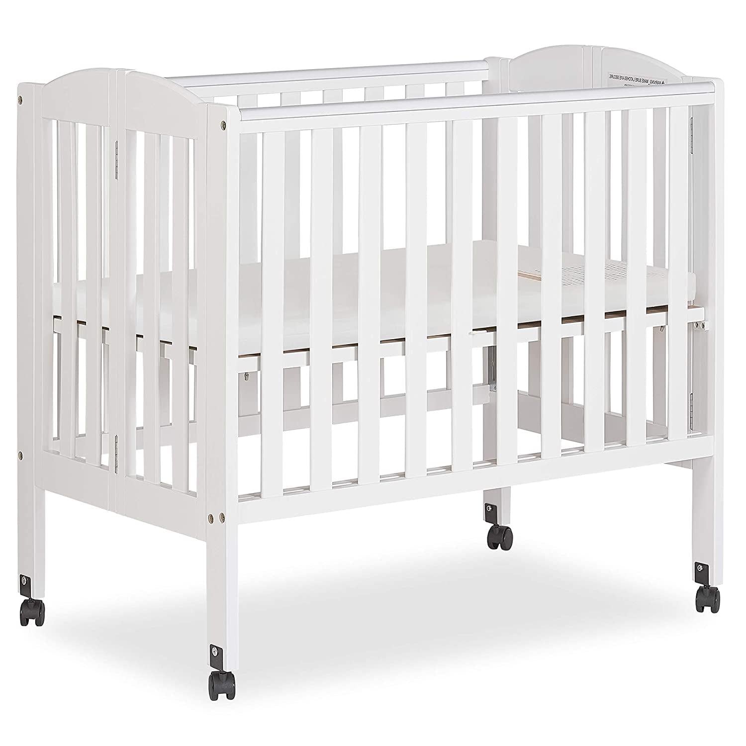 Dream on Me 2 - in - 1 Folding Portable Mini Crib in White. Mattress Pad Included. Easy to Fold and Store Baby Crib. Two Adjustable Mattress Height Positions Convertible Crib