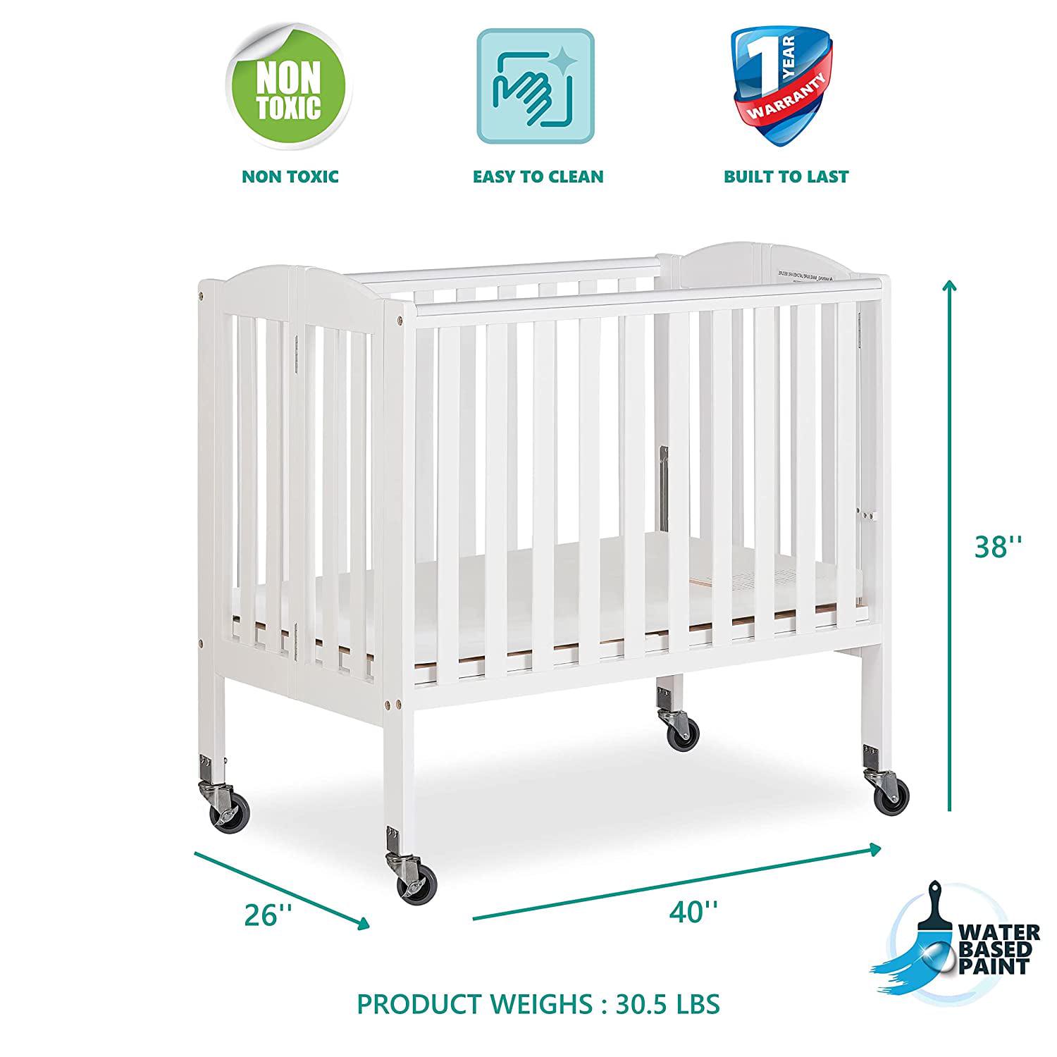Dream on Me 2 - in - 1 Folding Portable Mini Crib in White. Mattress Pad Included. Easy to Fold and Store Baby Crib. Two Adjustable Mattress Height Positions Convertible Crib