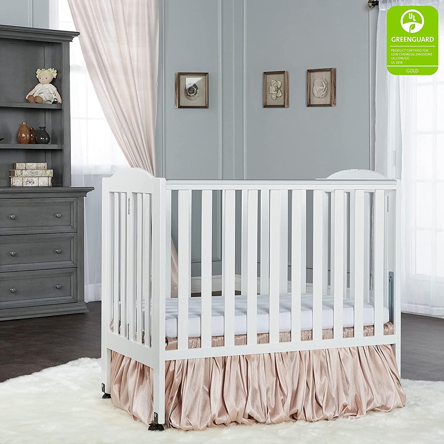 Dream on Me 2 - in - 1 Folding Portable Mini Crib in White. Mattress Pad Included. Easy to Fold and Store Baby Crib. Two Adjustable Mattress Height Positions Convertible Crib