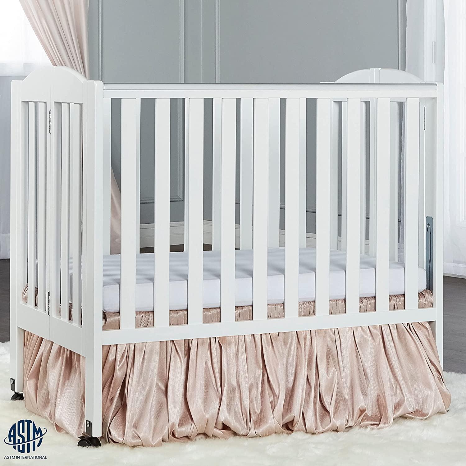 Dream on Me 2 - in - 1 Folding Portable Mini Crib in White. Mattress Pad Included. Easy to Fold and Store Baby Crib. Two Adjustable Mattress Height Positions Convertible Crib